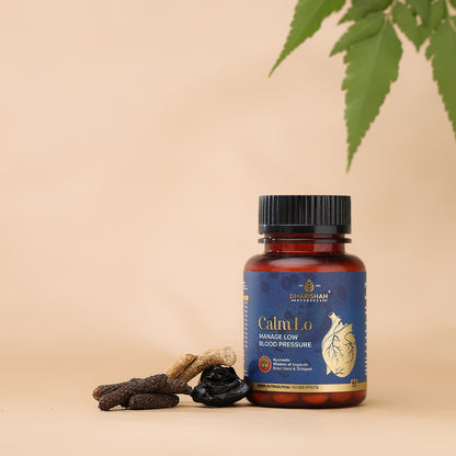 Calm Lo Tablets under fine green leaves.